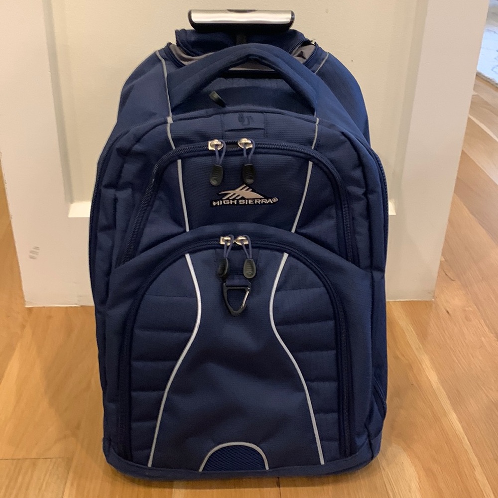 Gently used High Sierra rolling backpack in navy